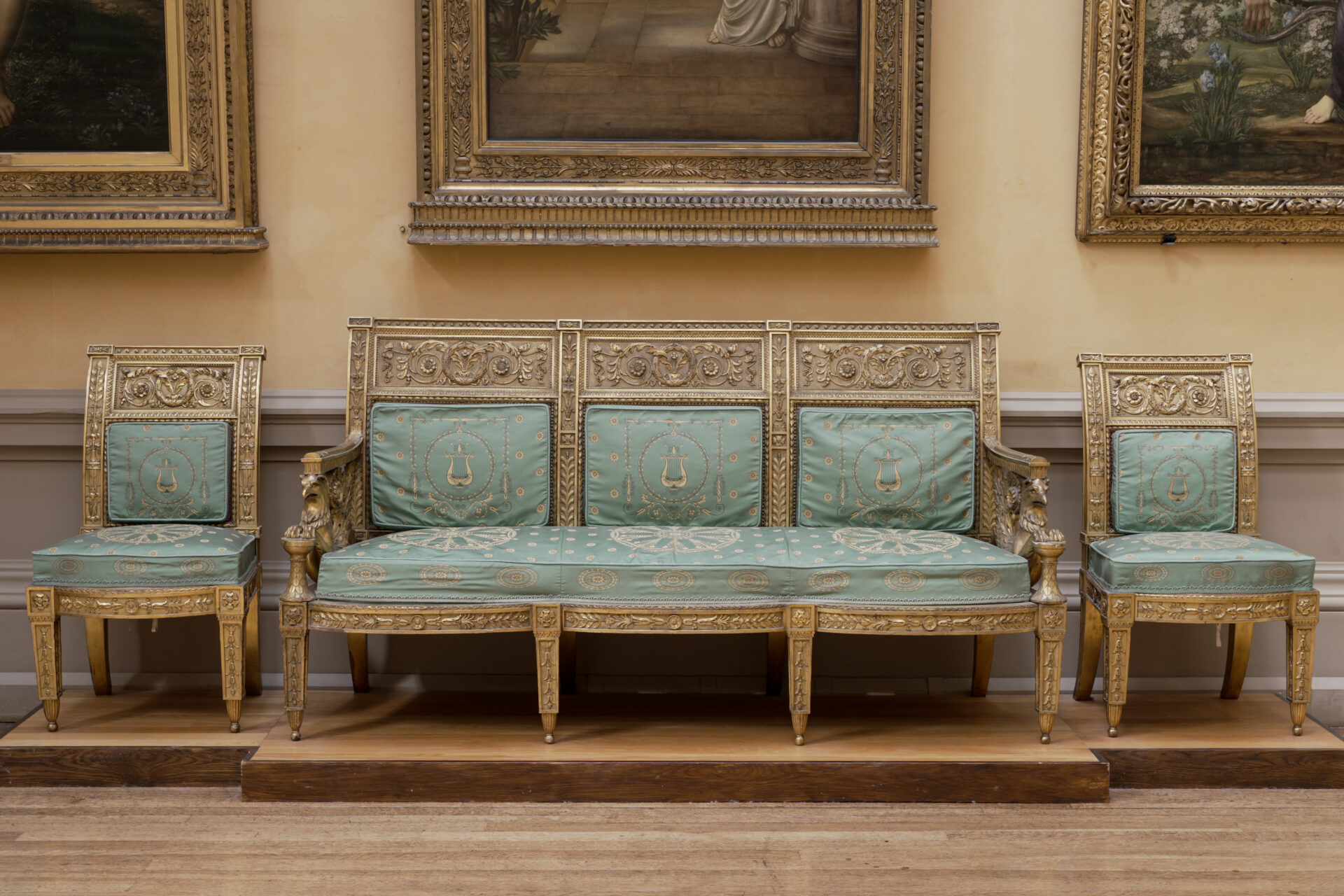 A suite of antique giltwood furniture.